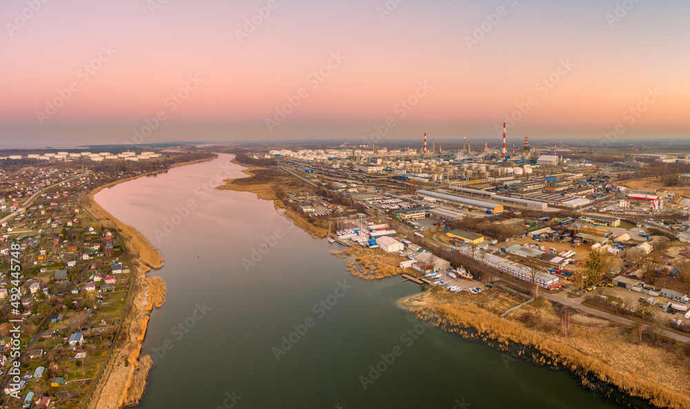 aerial view of gdansk oil refinery at sunset