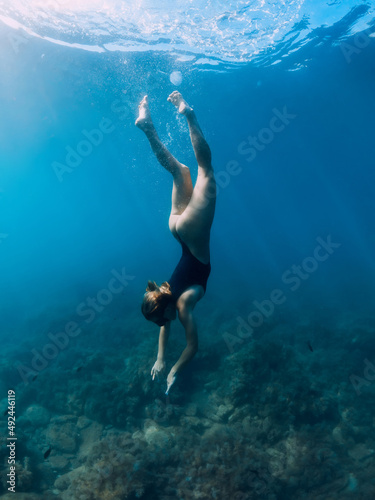 Woman underwater in sea. Freediving and beautiful lady in ocean