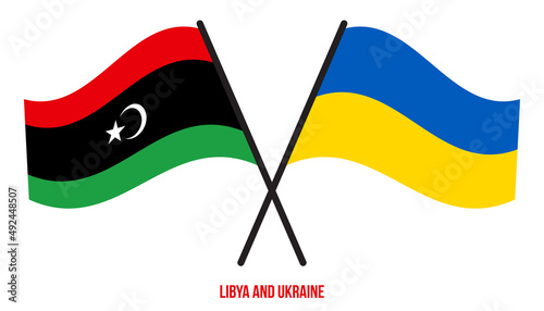 Libya and Ukraine Flags Crossed And Waving Flat Style. Official Proportion. Correct Colors.