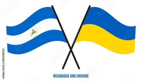 Nicaragua and Ukraine Flags Crossed And Waving Flat Style. Official Proportion. Correct Colors.