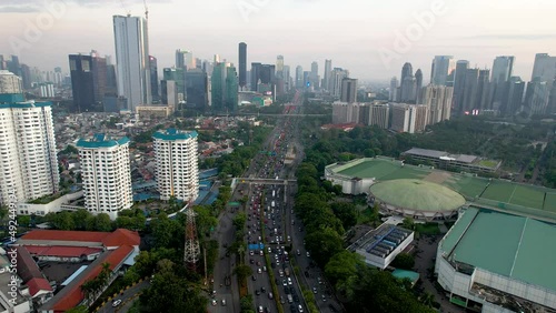 Aerial view of Jakarta highway traffic along Jendral Sudirman road in the afternoon on weekday. Jakarta, Indonesia photo