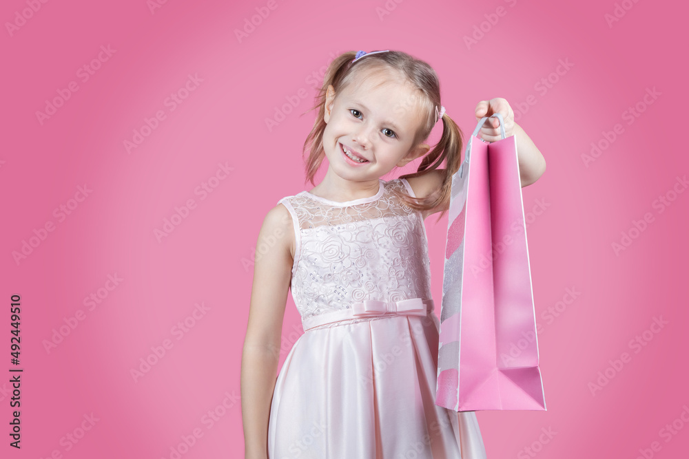 Portrait of positive girl have fun on free time holding colorful bags shopper Portrait of positive girl have fun on free time holding colorful bags shopper