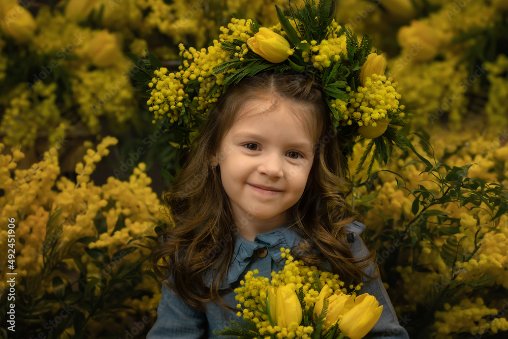 Beautiful girl with a bouquet of mimosa flowers Beautiful girl with a bouquet of mimosa flowers