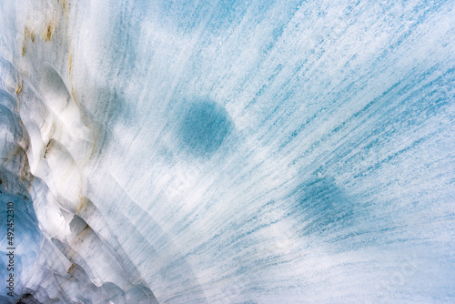 Breaking ice in glacier, ice wall texture taken from a natural glacier cave in Zinal, Switzerland 