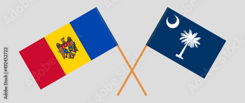 Crossed flags of Moldova and The State of South Carolina. Official colors. Correct proportion