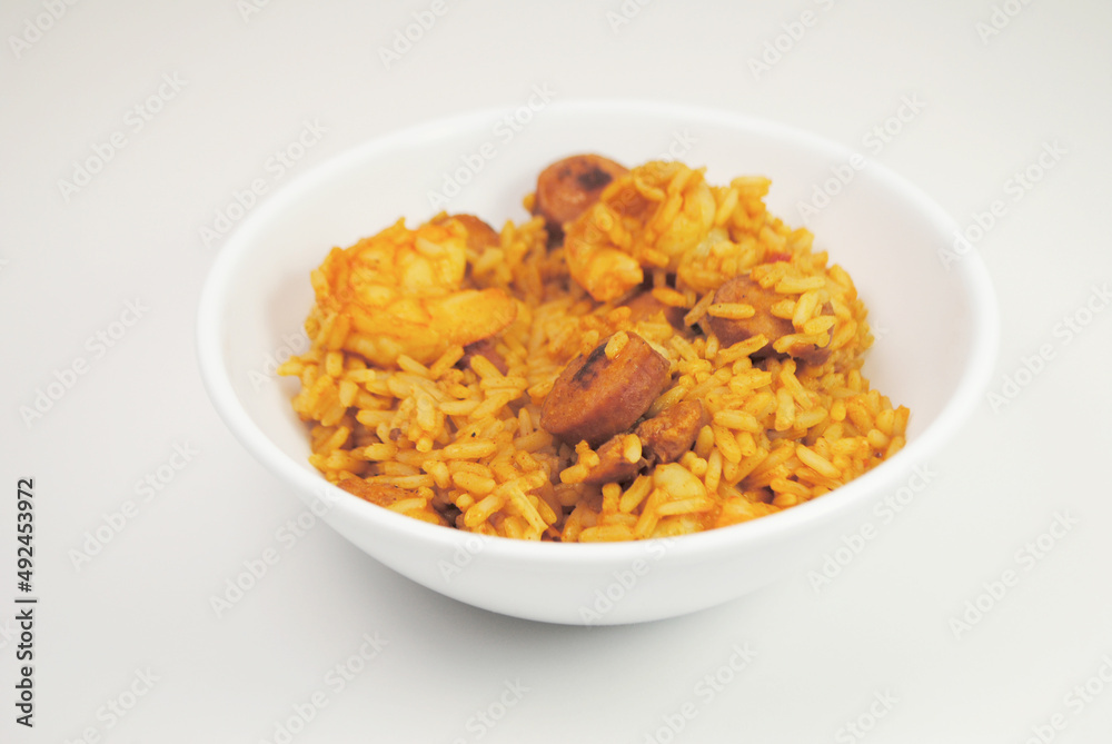 Shrimp and Sausage Jambalaya Served in a White Bowl Isolated Over a White Background Shrimp and Sausage Jambalaya Served in a White Bowl Isolated Over a White Background