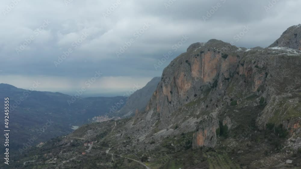 Drone shooting of Rocche del Crasto in winter, a mountainous and rocky complex where the golden eagle nests, Nebrodi, Sicily, Italy. Typical villages set between the fortresses. Longi and Alcara. Drone shooting of Rocche del Crasto in winter, a mountainous and rocky complex where the golden eagle nests, Nebrodi, Sicily, Italy. Typical villages set between the fortresses. Longi and Alcara.