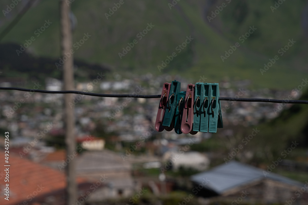 a beautiful fabulous mountain trail with a fence along the edge, where in the distance you can see the clan village. a beautiful fabulous mountain trail with a fence along the edge, where in the distance you can see the clan village.