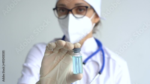 Infectious doctor show COVID 19 vaccine for prevention, immunization and treatment for new corona virus infection. Medical technology concept