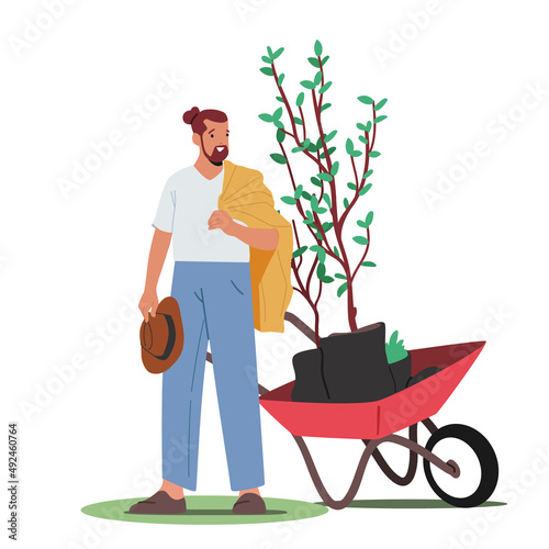 Nature and Ecology Concept. Male Character Planting Trees Seedlings to Soil in Garden, Man Move Plant on Wheelbarrow