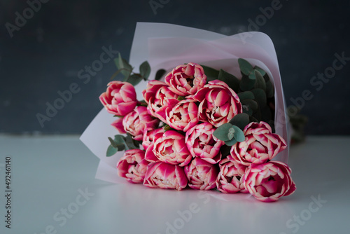 Wallpaper Mural Fresh tulips bouquet. Bouquet of spring tulips flowers isolated on white and grey background Torontodigital.ca