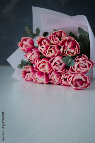 Wallpaper Mural Fresh tulips bouquet. Bouquet of spring tulips flowers isolated on white and grey background Torontodigital.ca