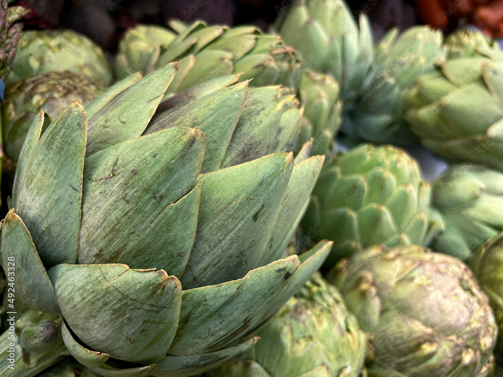 Green artichokes for sale in the market Green artichokes for sale in the market