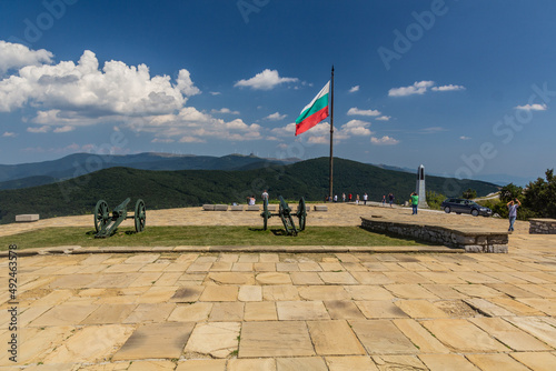 SHIPKA, BULGARIA - JULY 27, 2019: Flag of Bulgaria and a cannons at the Liberty Memorial on Shipka Peak, Bulgaria