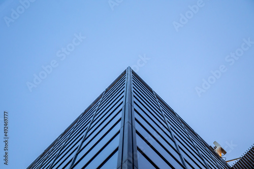 Windows of modern building office skyscraper with perspective background sky