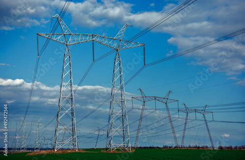 Wallpaper Mural  high-voltage power lines at sunset. greeb field. Torontodigital.ca