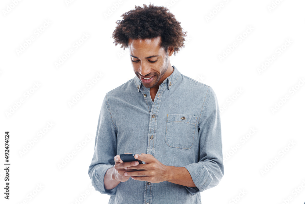 Cant wait for the next text. Studio shot of a handsome man using his mobile phone isolated on white. Cant wait for the next text. Studio shot of a handsome man using his mobile phone isolated on white.
