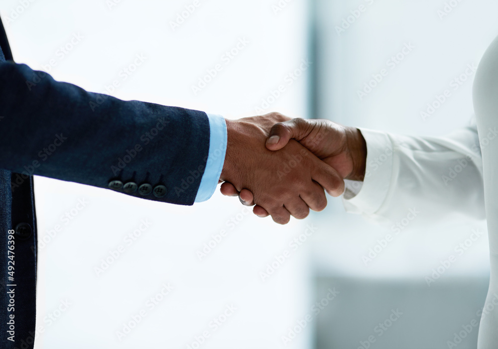 Winning hands in the negotiation game. Closeup shot of two unidentifiable businesspeople shaking hands in an office. Winning hands in the negotiation game. Closeup shot of two unidentifiable businesspeople shaking hands in an office.