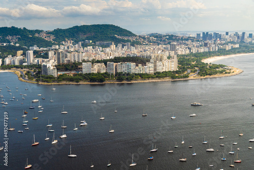 Aerial image of Botafogo and Flamengo cove and beach with its buildings, boats and landscape. Immensity of the city of Rio de Janeiro, Brazil in the background photo