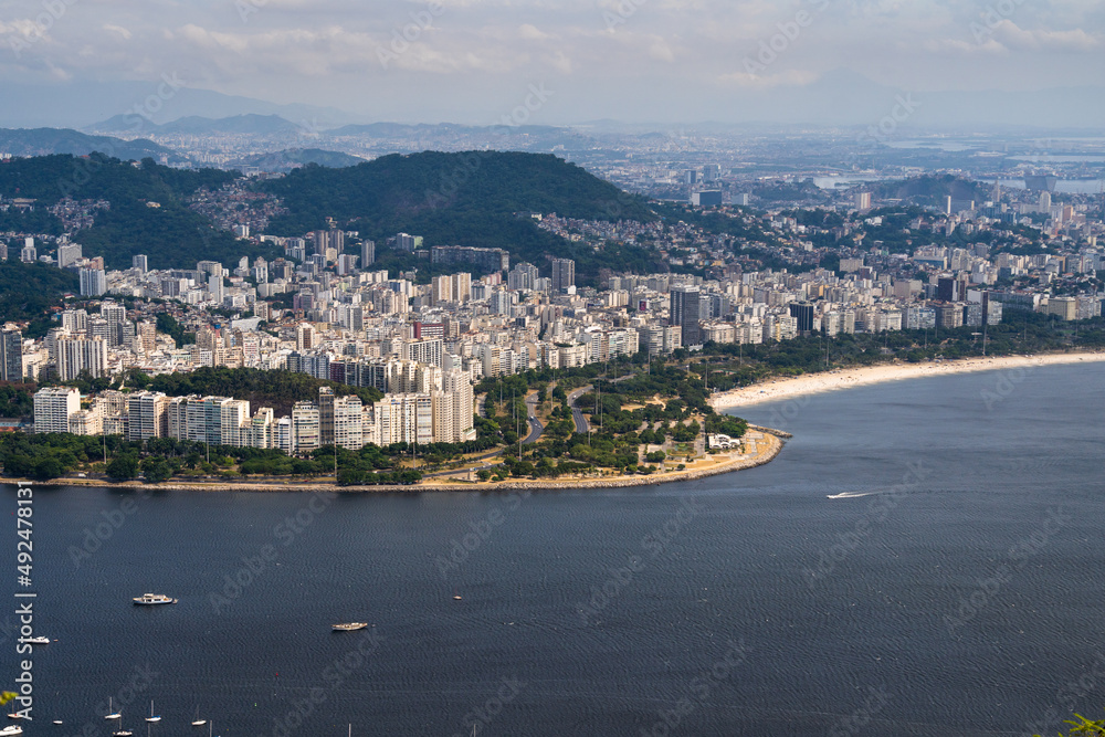 Fototapeta premium Aerial image of Botafogo and Flamengo cove and beach with its buildings, boats and landscape. Immensity of the city of Rio de Janeiro, Brazil in the background