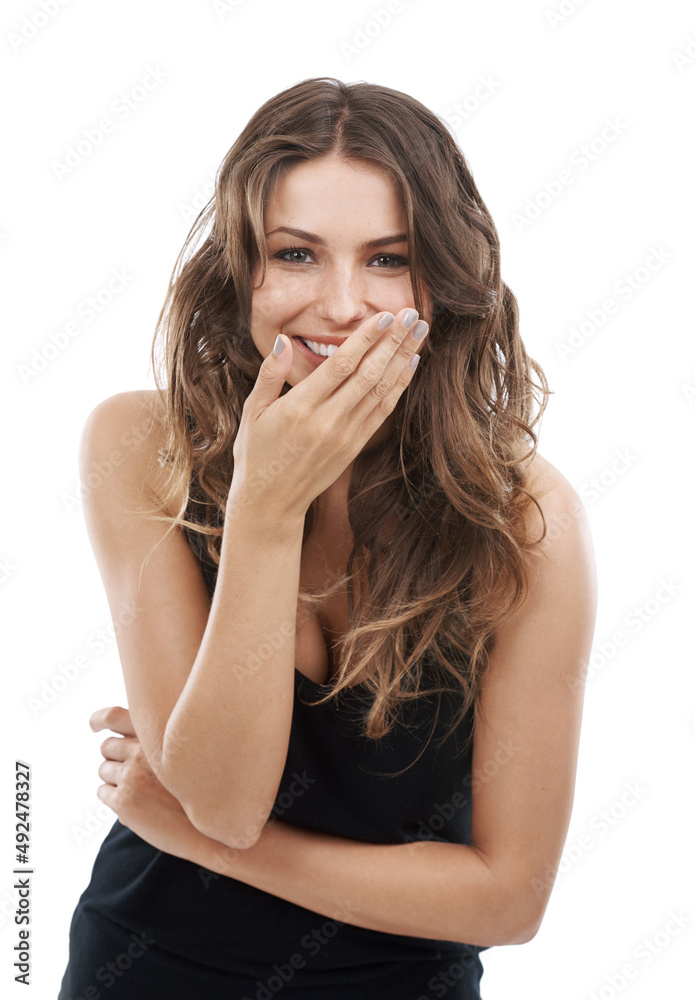 Having a laugh. Smiling young woman with her hand at her mouth. Having a laugh. Smiling young woman with her hand at her mouth.