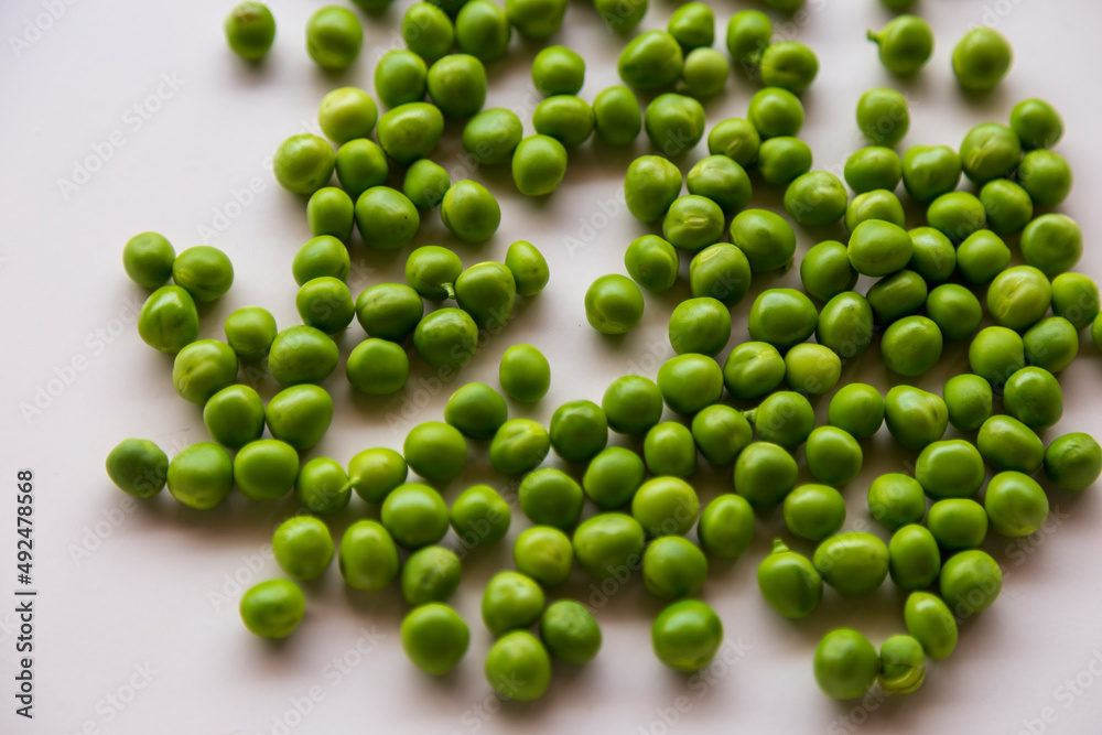 Green fresh peas isolated on white top view. Green fresh peas isolated on white top view.