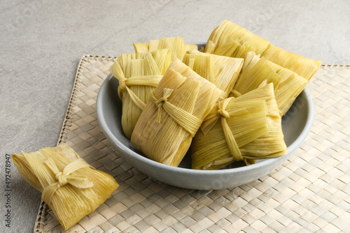 Lepet Jagung is a traditional Indonesian snack that is often found in Central Java, Indonesia, made from corn and grated coconut and wrapped in corn husks and steamed.
 photo