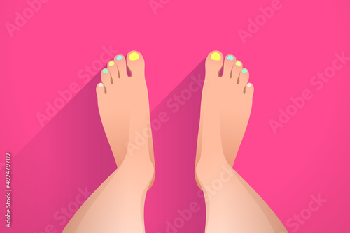 Legs of woman and colorful nails, pedicure and foot care