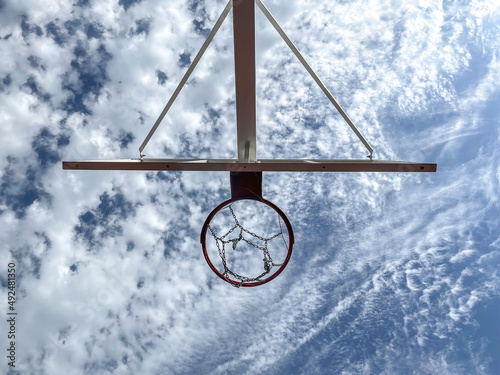 basketball court, a basket ring hoop against the sky