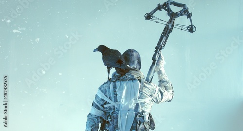 fighter with a crossbow and a raven