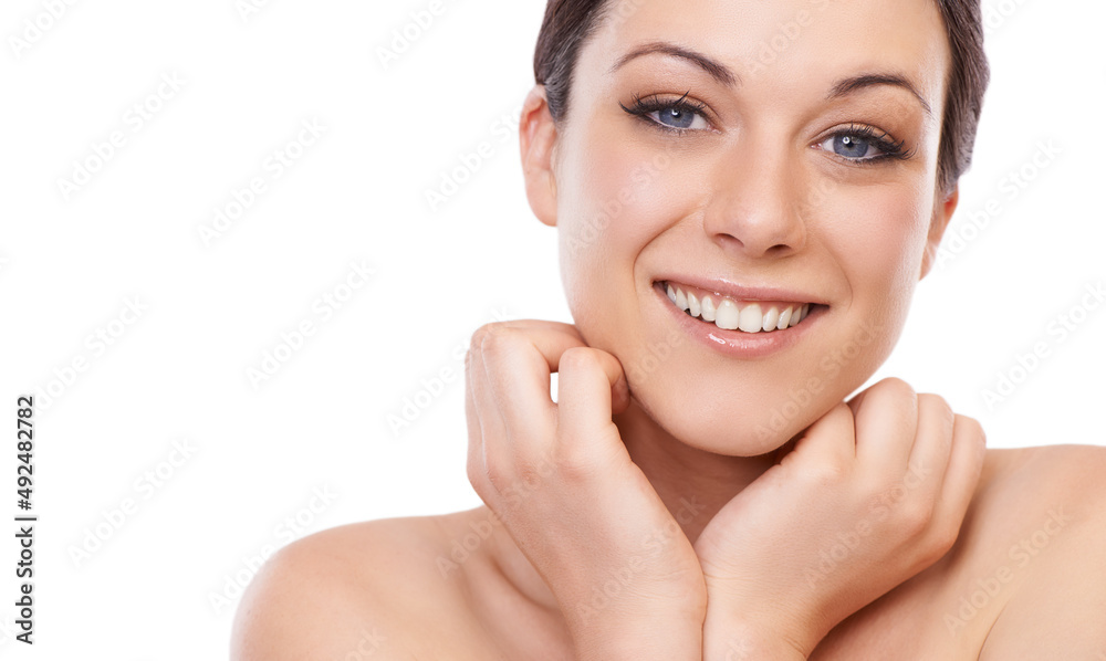 Naturally radiant. A beautiful young woman smiling at the camera while holding her face in her hands - copyspace. Naturally radiant. A beautiful young woman smiling at the camera while holding her face in her hands - copyspace.