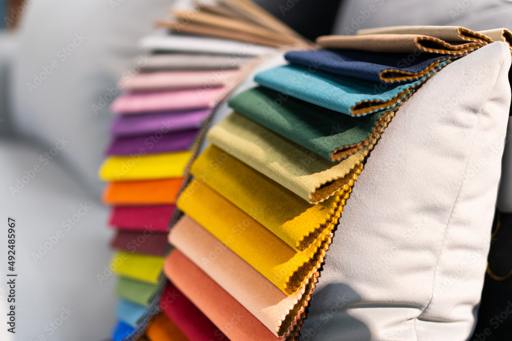 Tissue catalog. Catalog of multicolored fabric samples. Textile