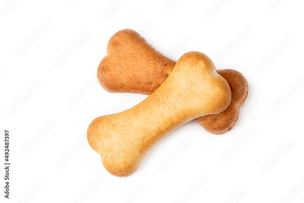 Brown dog biscuits on a white background Brown dog biscuits on a white background