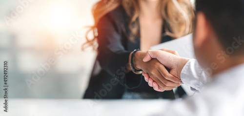 Businesswoman handshake and business people. Successful business concept. photo