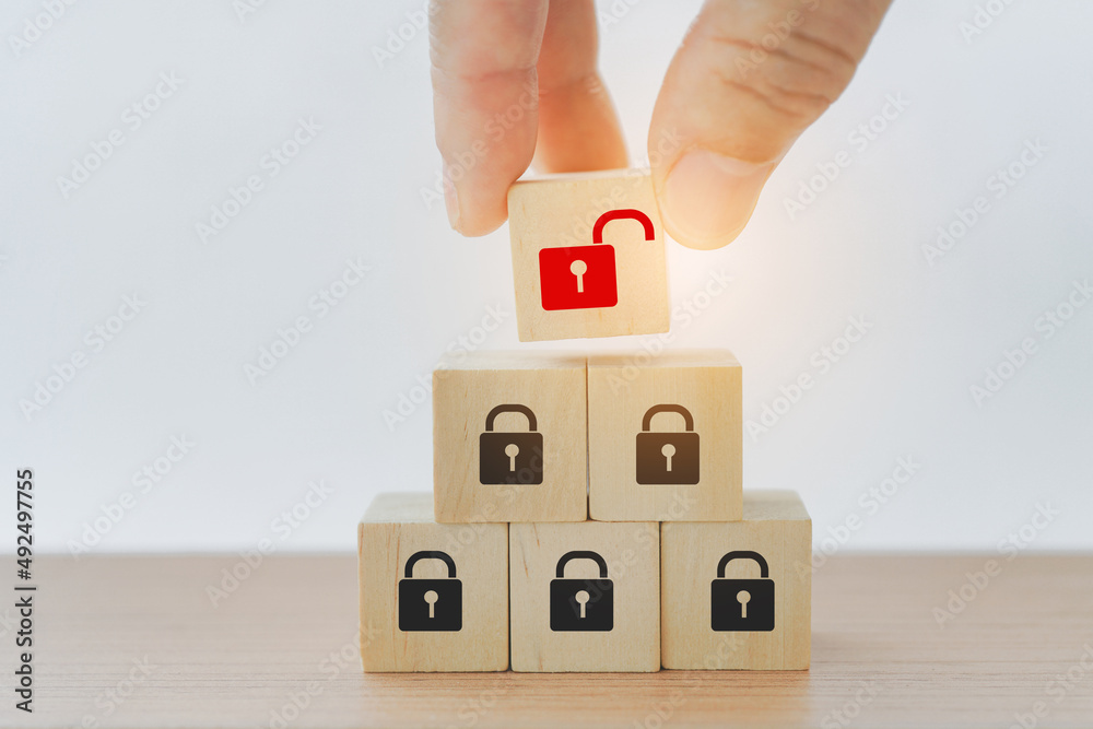 hand holds wooden cubes with red unlocked key on top pyramid for finding solutions concept. Business problem solving and make decision. New ideas and innovation. Team brainstorming to set strategies. hand holds wooden cubes with red unlocked key on top pyramid for finding solutions concept. Business problem solving and make decision. New ideas and innovation. Team brainstorming to set strategies.