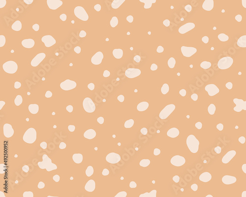  Deer skin texture seamless pattern. Perfect use for fabric, wallpaper, home decor. Abstract background with spots. Vector background on beige surface.