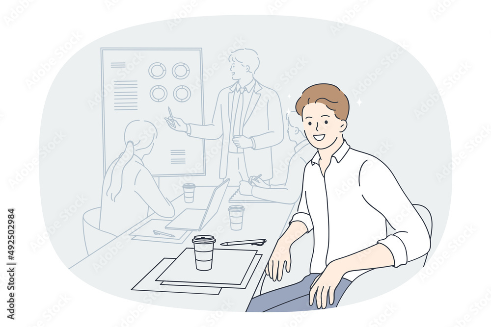 Smiling man employee at team meeting with coach or presenter in office. Happy male worker sit at desk with colleagues having briefing with group leader or boss. Flat vector illustration. 