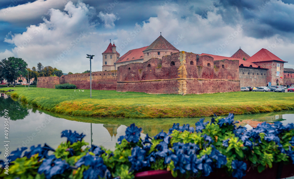 Fototapeta premium Captivating summer view of medieval Fagaras Citadel. Wonderful morninng scene of Transylvania, Romania, Europe. Traveling concept background.