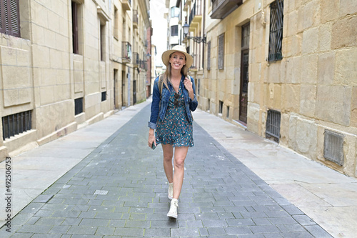 Young tourist woman visiting spanish city