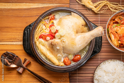 Ginseng chicken soup or Samgyetang, Koreans traditional food chicken stuffed with rice, ginsenga popular stamina food in summer. photo