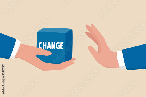Fotografiet Status quo bias, fear or refuse to change, comfort zone or conservative thinking, afraid of changing risk or resist to make decision concept, businessman hand denied or refuse to get change cube box