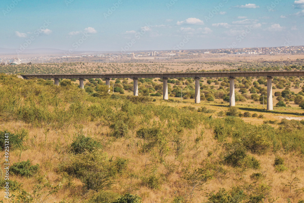 Scenic view of railway bridge on the Nairobi - Mombasa SGR railway seen from Nairobi National Park, Kenya