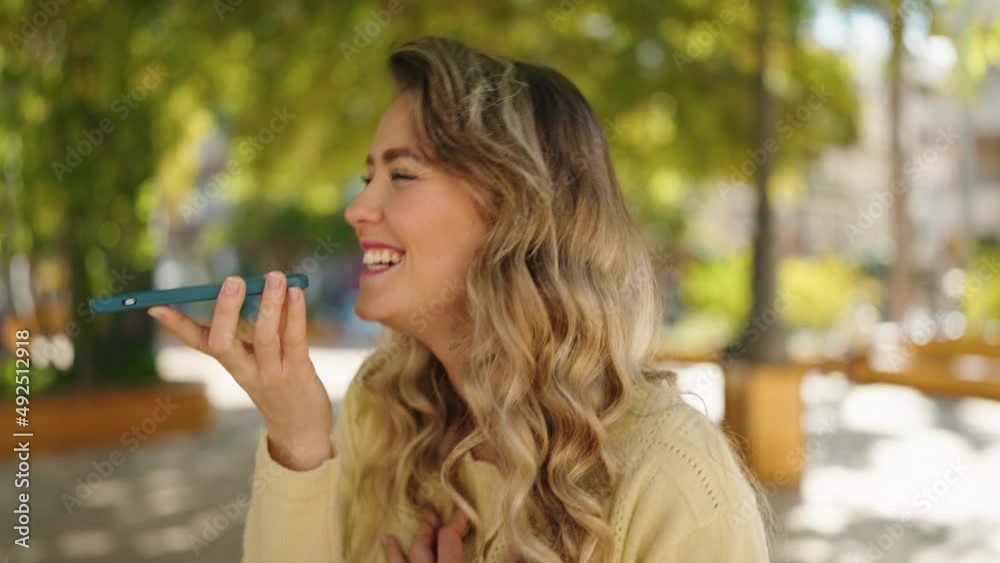 Young blonde woman smiling confident talking on the smartphone at park Young blonde woman smiling confident talking on the smartphone at park