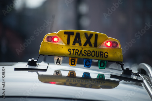 Strasbourg - France - 12 March 2022 - Closeup of french taxi sign on the roof of car in the street