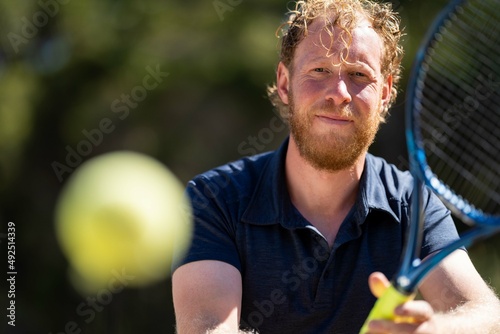 Tennis player, hitting tennis balls © William