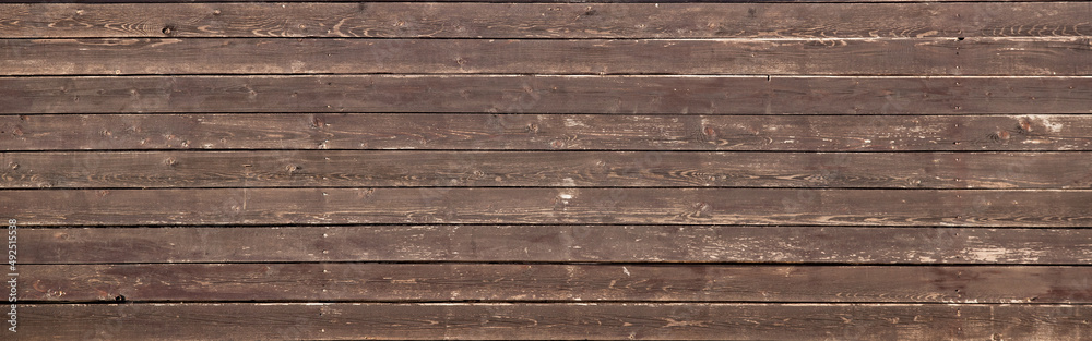 Wooden brown saturated gray background, fence texture. Wooden brown saturated gray background, fence texture.