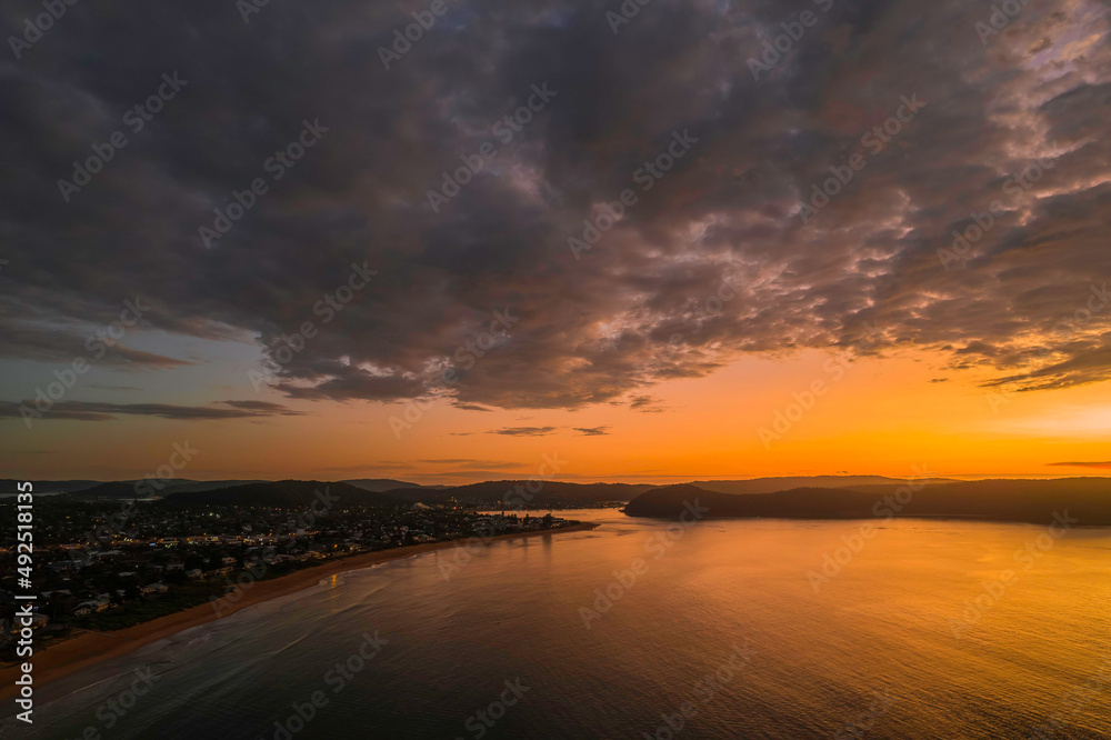 Aerial sunrise seascape with  low clouds