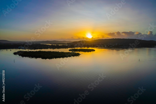 Hazy Sunrise Waterscape with Reflections
