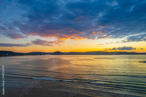 Aerial sunrise seascape with  low clouds