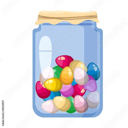 Easter glass jar with sweet candies decorated golden egg. Sweet food